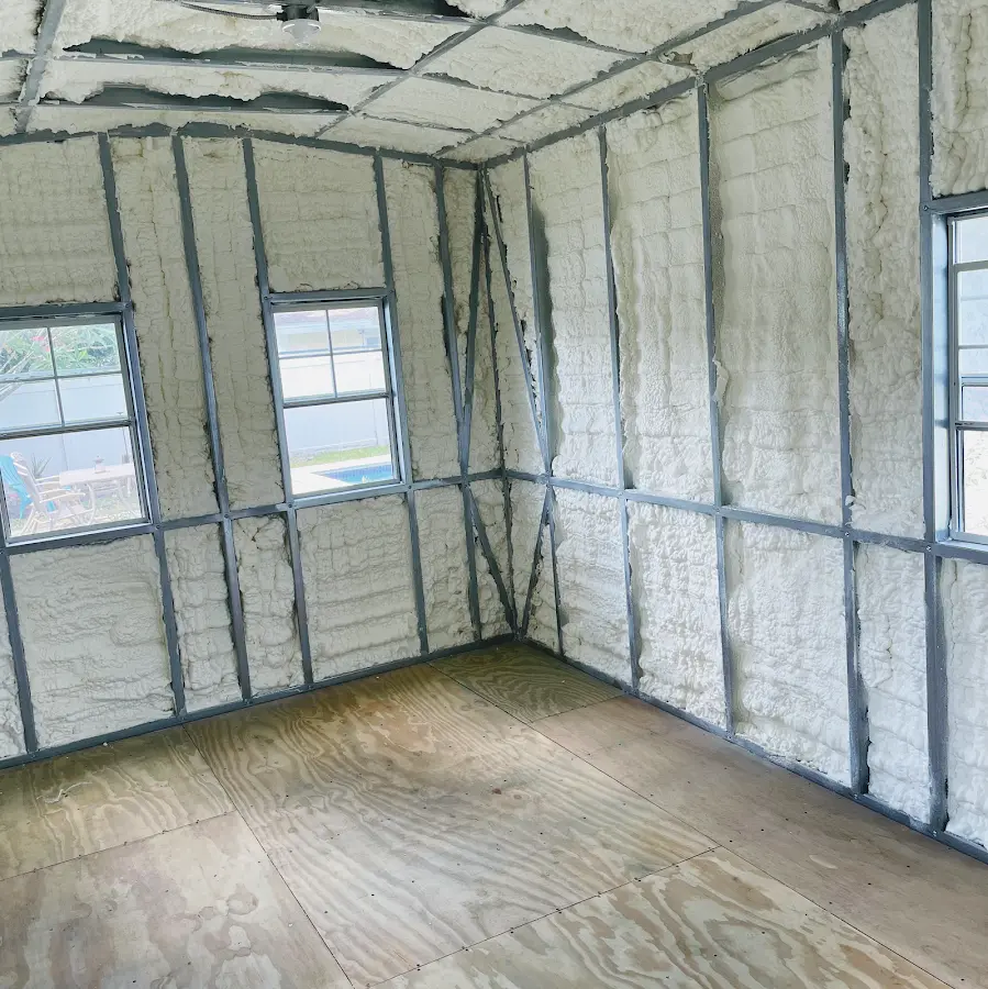 Closed-cell spray foam insulation applied to wall cavities in a residential project in Kings Park West